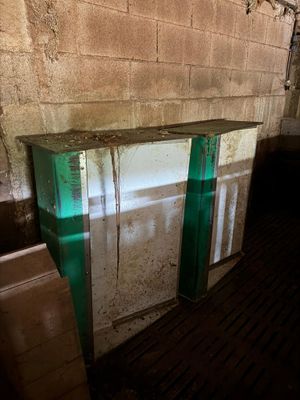 a refrigerator that is sitting in the corner of a room