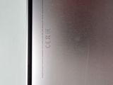 a close up of the back of a cell phone on a table