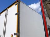 a truck that is parked next to a building
