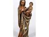 a statue of a woman holding a baby in her arms