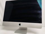 an apple desktop computer sitting on top of a white table