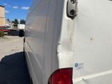 a white van that is parked in a parking lot