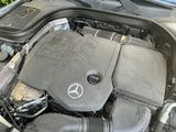 a picture of a car engine with the hood open