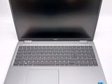 a laptop computer sitting on top of a white table