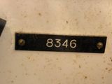 a picture of a number plate on a refrigerator