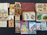 a lot of children ' s books and games on the table