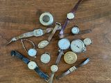 many different types of watches on a wooden table