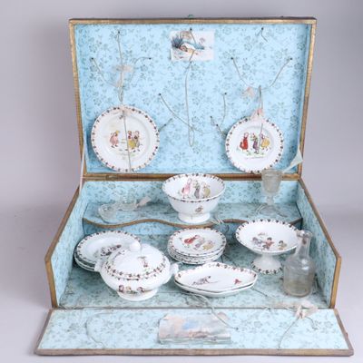 a suitcase that has a tea set inside of it