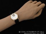 an image of a woman ' s wrist with a watch on it