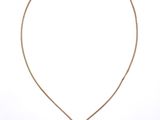 a necklace with a purple stone on a gold chain