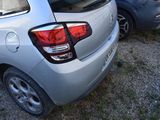 two cars parked next to each other on the side of the road