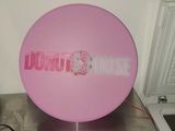 a pink balloon with the word donut house on it