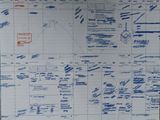 a large sheet of paper with blue writing on it
