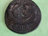an old coin with a picture of a man on it