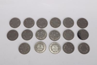 a close up of a bunch of coins on a white surface