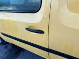 a yellow van parked on the side of the road