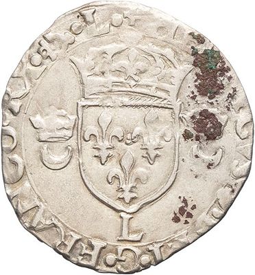 a silver coin with a crown on top of it