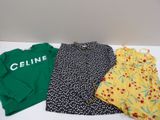 three children ' s clothing are sitting on a table next to each other