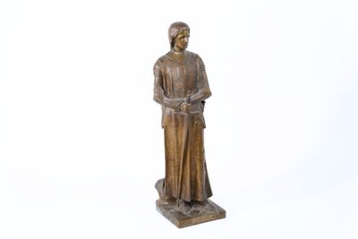 statue of a woman with a hat and a cane on a white background