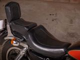 a close up of a motorcycle with a seat on it