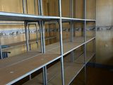 a room with a lot of empty shelves in it