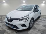 a white car parked in a garage with a checkered floor