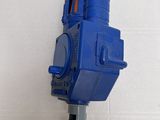 a blue and orange water gun attached to a wall