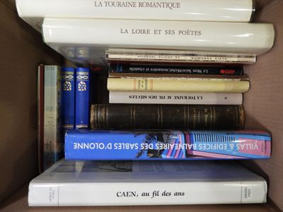 many books in a box that are stacked on top of each other
