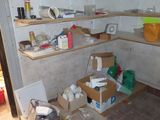 a room with a lot of boxes and boxes on the shelves
