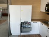 a kitchen with a refrigerator, stove, sink, and refrigerator freezer