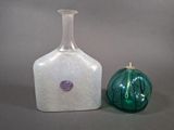 two vases sitting next to each other on a table