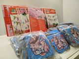 many bags of children ' s toys on the counter