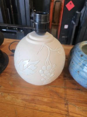 two vases sitting on a table next to each other