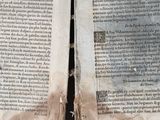 two pages of an old book that have been torn open