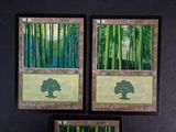 three cards with a picture of a tree in the middle of them
