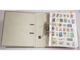 un livre ouvert avec des timbres sur une table
