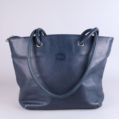 a blue leather tote bag with two handles on a white background