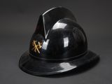 an image of a black helmet with a gold emblem on it