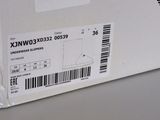 a box with a sticker on the side of it and a barcode on the side of the box