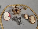 a lot of jewelry that is laying out on the table