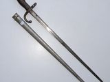 a pair of two swords, one of which has been used as a weapon