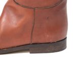 brown leather boots on a white background with a white background