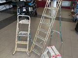 many ladders that are sitting in the middle of a room