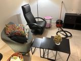 a living room with a couch, chair, coffee table and television