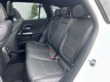 the back seats of a white suv with black leather trims