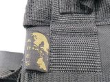 a close up of a black belt with a gold logo on it