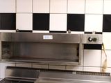 an image of a kitchen with a stove and a stove top