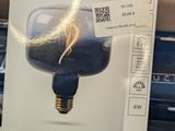 someone is holding a box with a light bulb inside of it