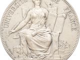 l'image d'une pièce d'argent représentant une femme assise sur une chaise