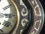 a close up of a clock with roman numerals on it